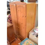 A modern pine fronted two door wardrobe over three full width drawers approx. 6ft high