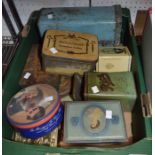A box of vintage domestic and advertising tins