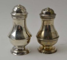 Two Georgian silver casters of bun top, baluster form, combined weight 135g