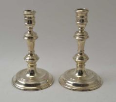 A pair of George ll design silver candlesticks, 19cm high