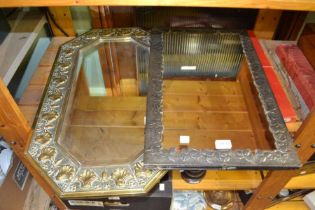 A brass arts and crafts style mirror with another pewter example