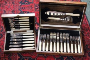 Two wooden cases of vintage cutlery