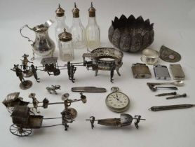 Various Chinese silver figures, a Georgian silver cream jug on trefid feet and various items