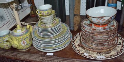 A Chinese tea and dinner service, with a selection of other plates and a bowl