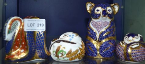 Four various Royal Crown Derby animal paperweights with buttons