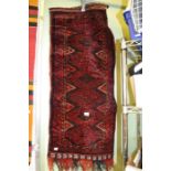 A red ground small Nomadic mat