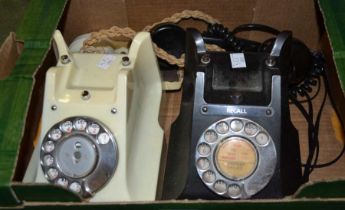 Two vintage dial telephones - one black one ivory