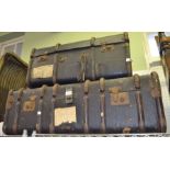 Two vintage wooden bound travel trunks