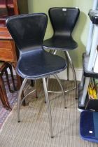 A pair of "The Chair Company" black leather swivel seat bar stools