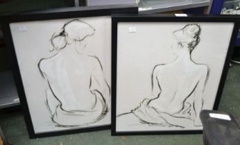 A pair of black and white prints of seated ladies