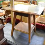 A mahogany and satin wood square topped low table with solid under tier (cut down)