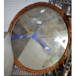 A round wicker mirrored tray