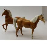 Two Beswick palomino horses (2)