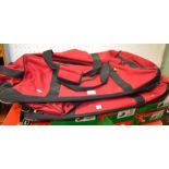 Two red "Elevation" wheeled holdalls