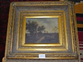 A rural scene in ornate gilt frame