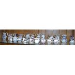 A shelf of small sized jugs - mainly 'Masons'