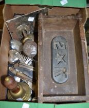 A box of door knobs and assorted metal wares