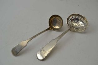 A Georgian silver pierced fiddle pattern handled sifter ladle, bearing a crest together with a Scott