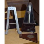 Maelzel vintage metronome with a metal piano top music stand