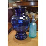 A large modern blue glass vase 41cm high and a retro blue glass soda-syphon