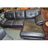 A black leather three seater settee having foot rest extension to one side