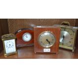A carriage clock with three mantle clocks (4)