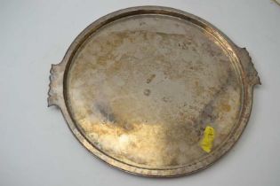 A Birmingham Guild of Handicrafts circular tray with shaped handles, silver plate on copper, stamped