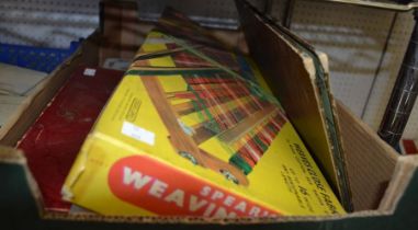 A box containing a vintage weaving loom, mah-jongg sets etc