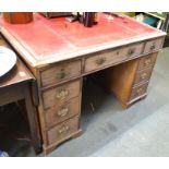 A George III mahogany partners desk having three in-line drawers on two drawer