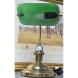 A traditional green shaded bankers lamp
