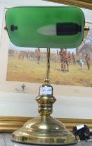 A traditional green shaded bankers lamp