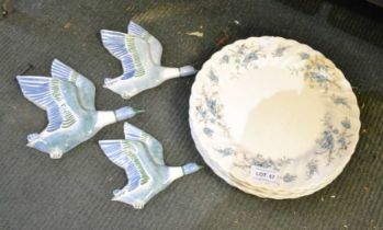 A trio of Rye pottery graduating flying ducks and five floral plates