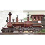 A large wooden with metal components American steam locomotive