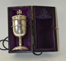 A Silver traveling Communion set, 111g, in cylindrical "A.R.Mowbray and Co Ltd" of Oxford and London