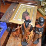 A selection of African carved figures and a giraffe