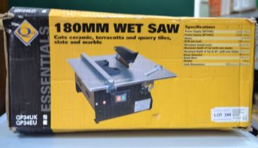 A boxed 180 mm wet saw tile cutter