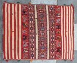 A Qashqai Mafrash rug, with red and cream stripes to either end