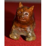 A South-East Asian pottery cat mottled brown glaze 7.5 cm long