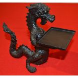 A cast metal visiting card holder in the form of a dragon 16 cm high