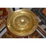 A 17th century style, German brass circular alms dishes, the 19th century, domed and spiral