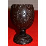 A 19th century coconut cup, carved decoration includes Scottish Thistle 12 cm high