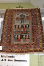 An antique Shirvan rug, pale blue ground with figurative decoration,