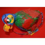 A painted model of an exotic bird 24 cm high