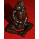 A contemporary group of two lovers entwined indistinctly signed and numbered 5/95, 8.5 cm