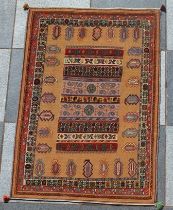 A Qashqai Soumak rug, cream ground with stylised designs, 1.1m x 1.56m