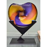 A glass multi-coloured dish indistinctly signed on metal stand