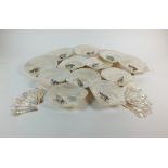 A set of twelve silver mounted mother of pearl shell oyster/hors doeuvres dishes