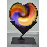 A glass multi-coloured dish indistinctly signed on metal stand