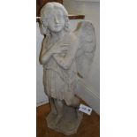 A 19th century marble statue of an angel wearing robes, her hands crossed across her breast, with tr