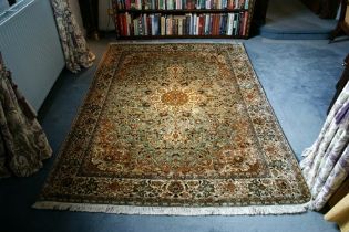 A Kashmir silk rug, the central medallion with stylized floral motifs
